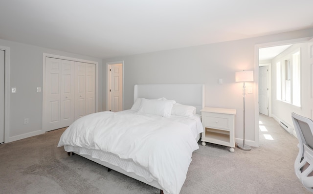 1 Ephraim Tyler Way Unit 1, Kennebunk, ME 04043 - bedroom featuring light carpet, baseboard heating, and a closet