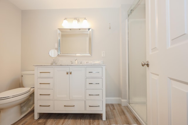 1 Ephraim Tyler Way Unit 1, Kennebunk, ME 04043 - bathroom featuring vanity, wood finished floors, and an enclosed shower