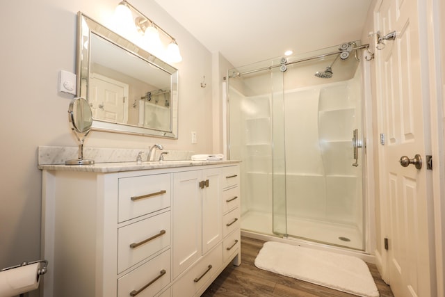 1 Ephraim Tyler Way Unit 1, Kennebunk, ME 04043 - bathroom with a shower stall, vanity, and wood finished floors