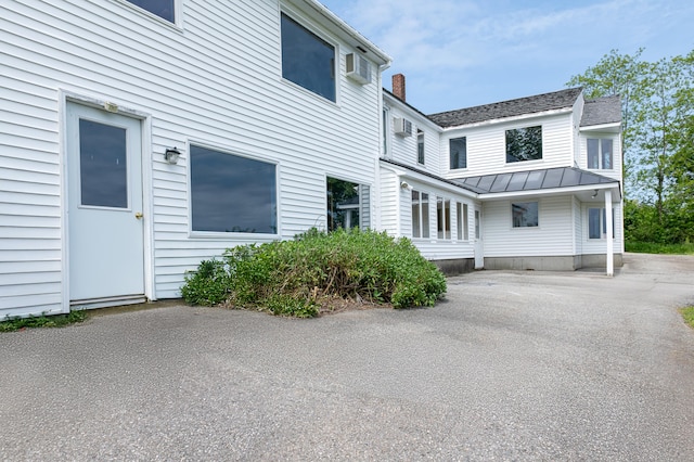 34 Old County Rd, Rockport, ME 04841 - view of side of home with a standing seam roof, a metal roof, and a shingled roof