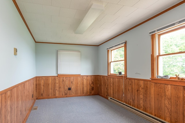 34 Old County Rd, Rockport, ME 04841 - carpeted spare room with a baseboard heating unit, a wainscoted wall, crown molding, and wood walls