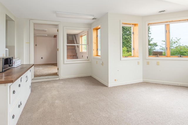 34 Old County Rd, Rockport, ME 04841 - unfurnished living room featuring light colored carpet and baseboards