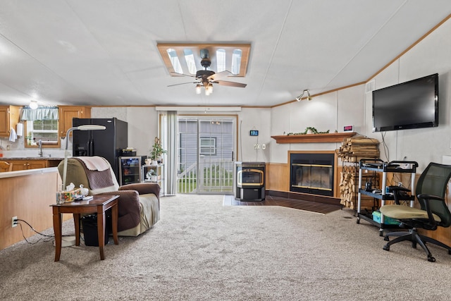 26 Caincrest Rd, York, ME 03909 - living room featuring carpet flooring, a fireplace with flush hearth, and a ceiling fan