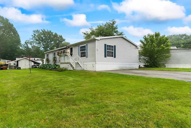 26 Caincrest Rd, York, ME 03909 - manufactured / mobile home featuring a front lawn