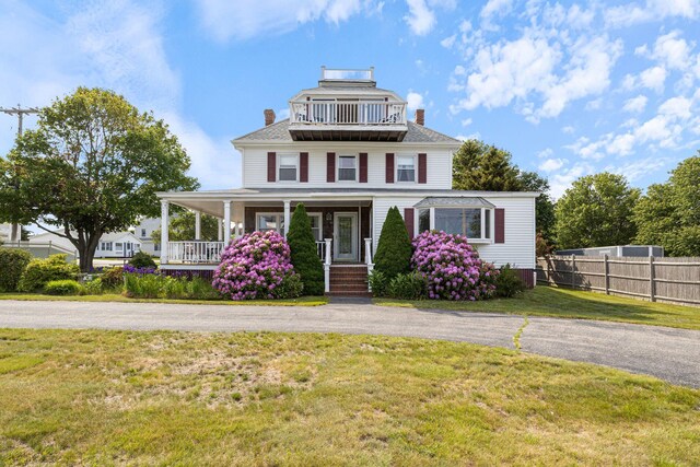 511 Webhannet Dr, Wells, ME 04090 - view of front of home with a chimney and covered porch