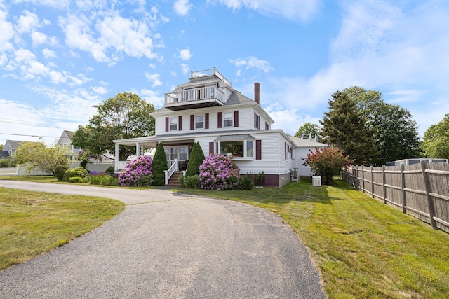 511 Webhannet Dr, Wells, ME 04090 - view of front of property with a chimney, a balcony, and covered porch
