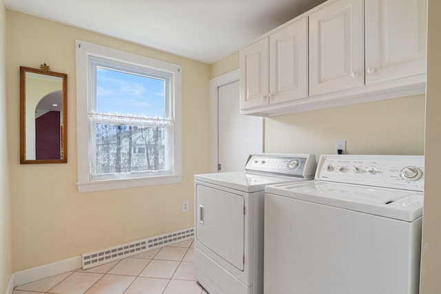 511 Webhannet Dr, Wells, ME 04090 - laundry room with a baseboard radiator, independent washer and dryer, cabinet space, and light tile patterned floors