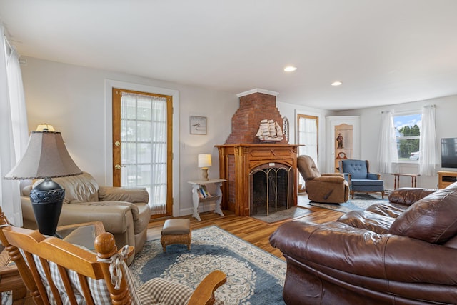 511 Webhannet Dr, Wells, ME 04090 - living room featuring light wood-style floors, a large fireplace, and recessed lighting
