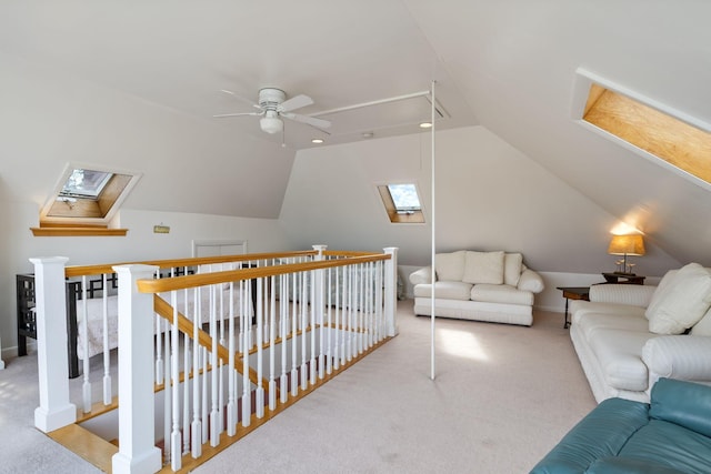511 Webhannet Dr, Wells, ME 04090 - additional living space with lofted ceiling, ceiling fan, carpet floors, a skylight, and attic access