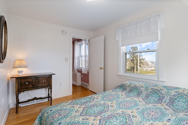 511 Webhannet Dr, Wells, ME 04090 - bedroom with multiple windows and wood finished floors