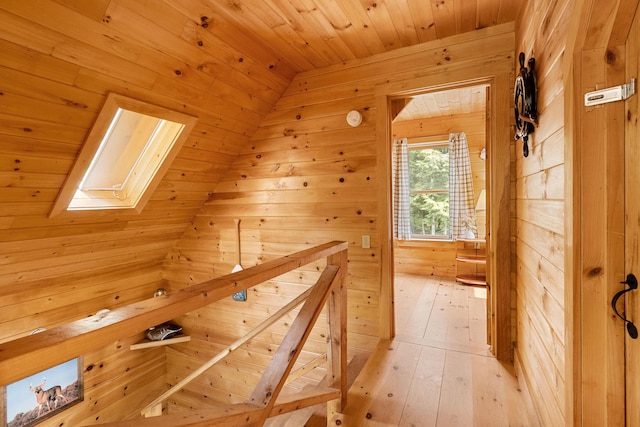 660 Sprague Rd, Waldoboro, ME 04572 - hall with a skylight, wooden ceiling, wood walls, and light wood finished floors