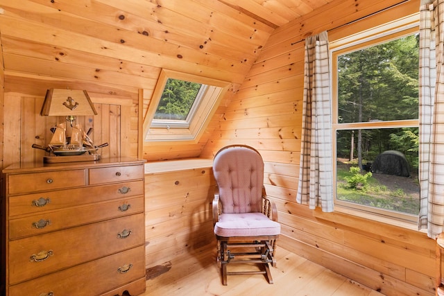 660 Sprague Rd, Waldoboro, ME 04572 - living area with a skylight, wooden ceiling, wooden walls, light wood finished floors, and lofted ceiling