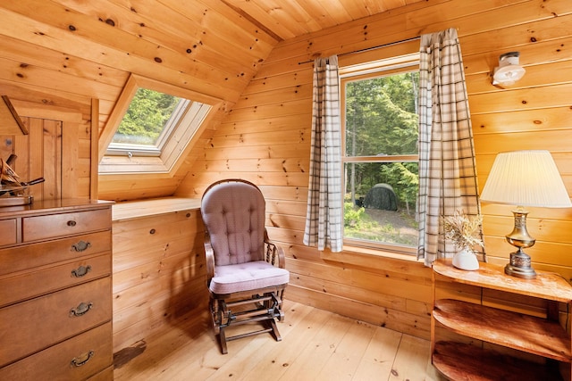 660 Sprague Rd, Waldoboro, ME 04572 - living area with a skylight, wood ceiling, healthy amount of natural light, wooden walls, and lofted ceiling