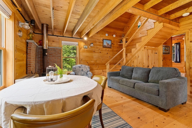 660 Sprague Rd, Waldoboro, ME 04572 - dining room featuring wooden walls, hardwood / wood-style floors, a wood ceiling with exposed beams, and stairway