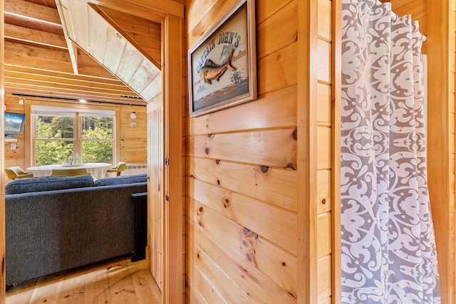 660 Sprague Rd, Waldoboro, ME 04572 - entryway featuring wooden walls, light wood-style floors, and lofted ceiling