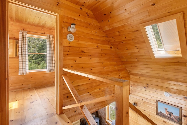660 Sprague Rd, Waldoboro, ME 04572 - hallway featuring a skylight, wood walls, a sauna / steam room, wood ceiling, and hardwood / wood-style floors