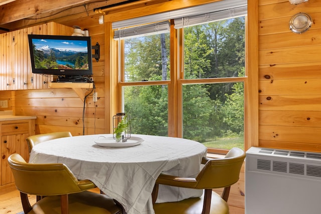 660 Sprague Rd, Waldoboro, ME 04572 - dining space with wooden walls and light wood-style flooring