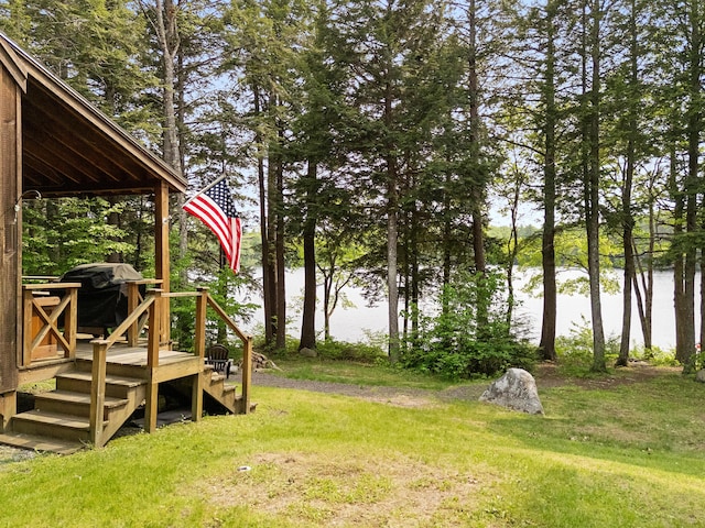 660 Sprague Rd, Waldoboro, ME 04572 - view of grassy yard with a deck with water view