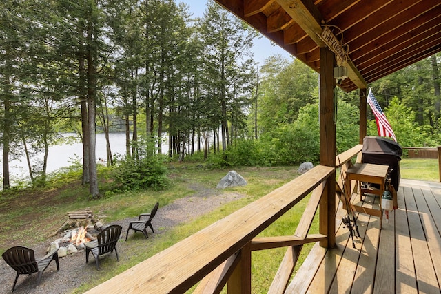660 Sprague Rd, Waldoboro, ME 04572 - wooden terrace with a fire pit and a water view