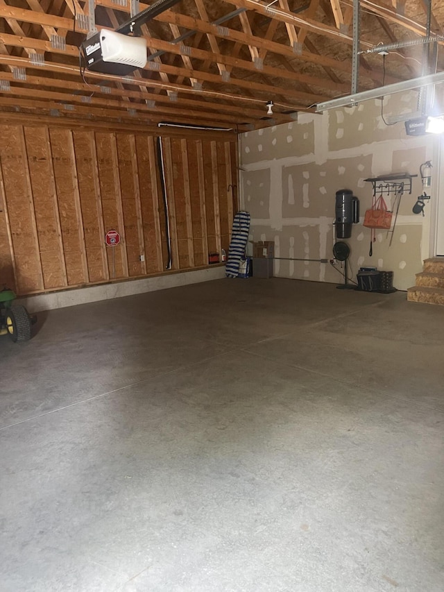 125 Carver Rd E, Monmouth, ME 04259 - garage with a garage door opener and a central vacuum unit