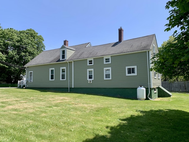 14 Third St, Eastport, ME 04631 - rear view of house featuring a chimney