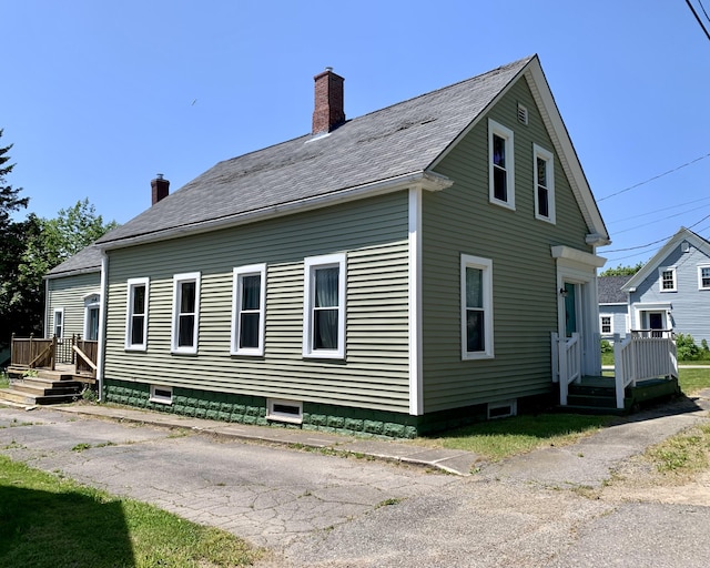 14 Third St, Eastport, ME 04631 - view of home's exterior with a chimney