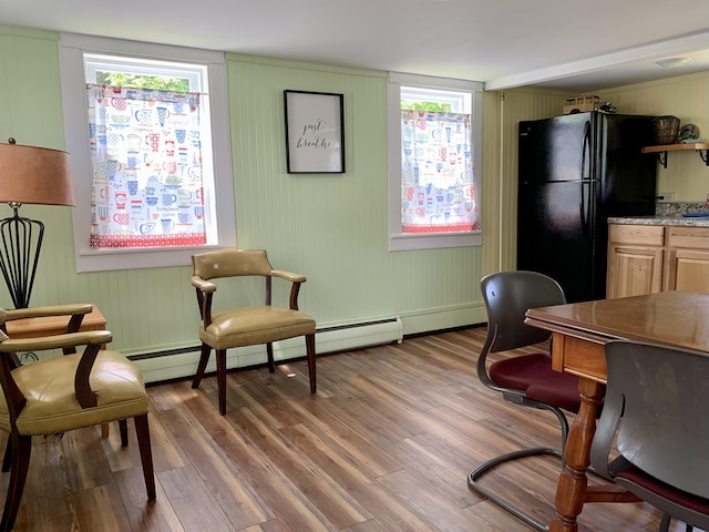 14 Third St, Eastport, ME 04631 - home office featuring wood finished floors and a baseboard heating unit