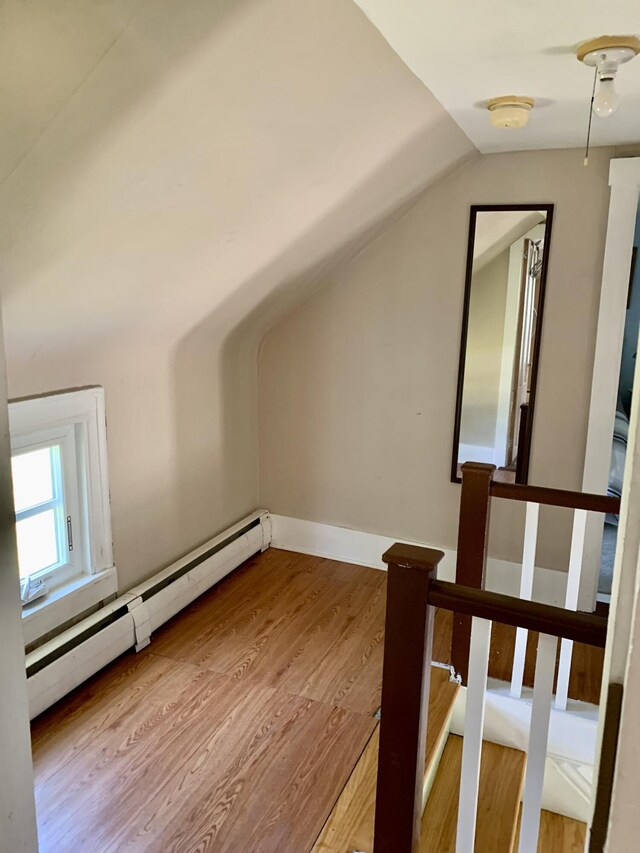 14 Third St, Eastport, ME 04631 - bonus room featuring a baseboard heating unit, wood finished floors, and vaulted ceiling
