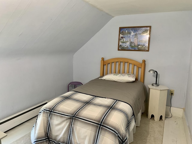 14 Third St, Eastport, ME 04631 - bedroom featuring vaulted ceiling, a baseboard radiator, and light colored carpet