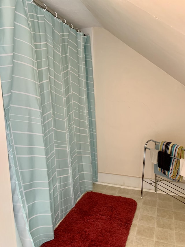 14 Third St, Eastport, ME 04631 - full bathroom with lofted ceiling and tile patterned floors