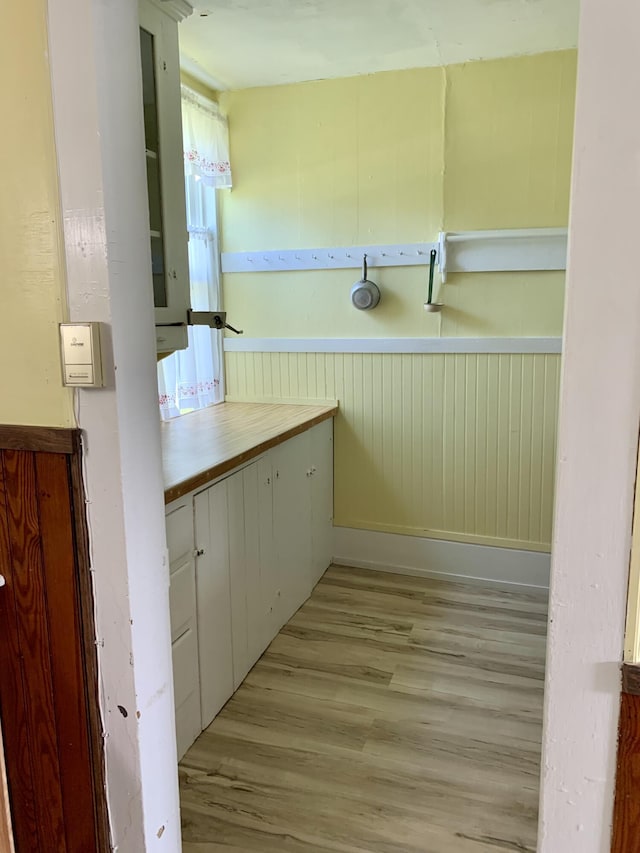 14 Third St, Eastport, ME 04631 - bathroom featuring wood finished floors and a wainscoted wall