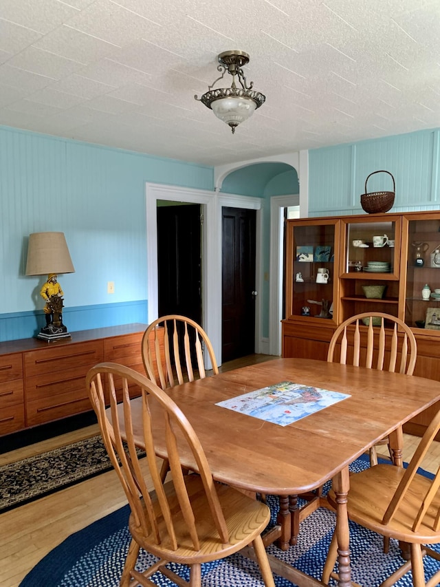 14 Third St, Eastport, ME 04631 - dining space featuring light wood-type flooring and arched walkways