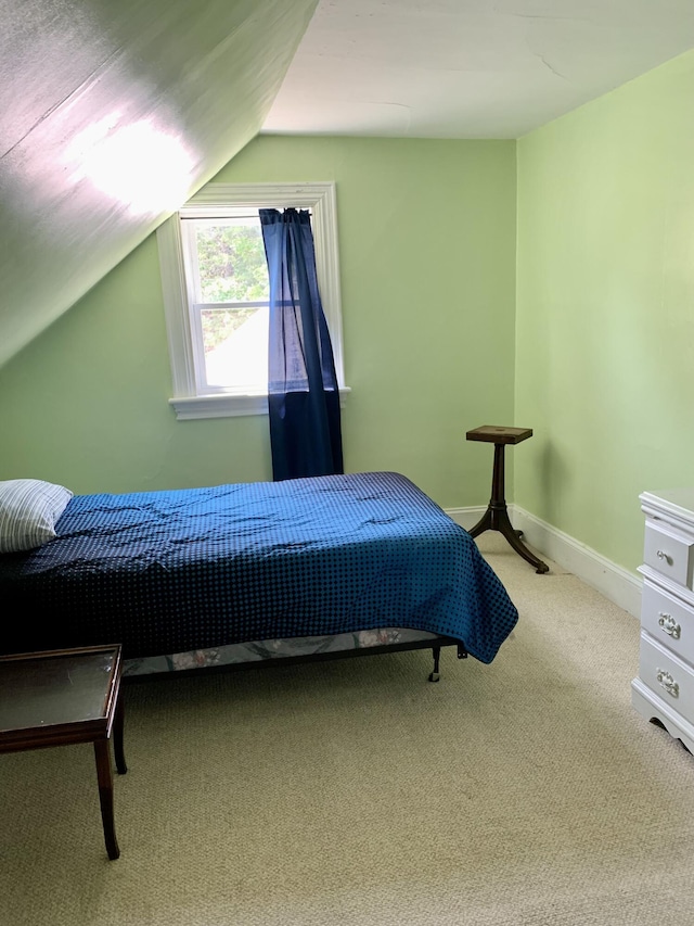 14 Third St, Eastport, ME 04631 - carpeted bedroom featuring lofted ceiling and baseboards