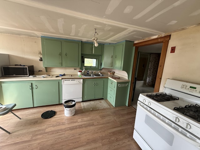 152 Kansas Rd, Milbridge, ME 04658 - kitchen featuring white appliances, green cabinetry, wood finished floors, and light countertops