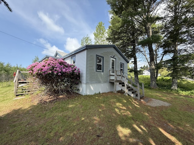 152 Kansas Rd, Milbridge, ME 04658 - view of side of home with a yard and stairway