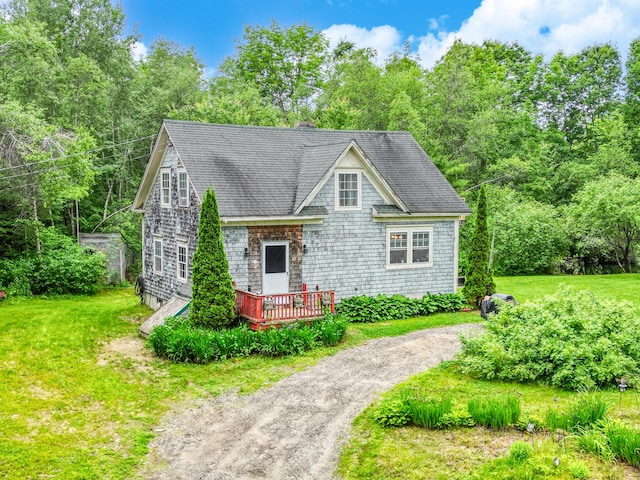 208 Benson Rd, West Gardiner, ME 04345 - view of front of home with a deck, a front yard, and roof with shingles