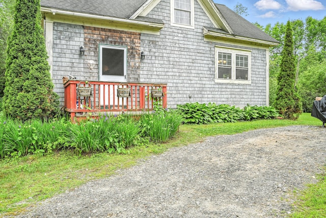 208 Benson Rd, West Gardiner, ME 04345 - view of home's exterior featuring a wooden deck and roof with shingles