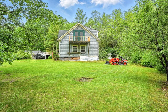208 Benson Rd, West Gardiner, ME 04345 - rear view of property with a balcony and a lawn