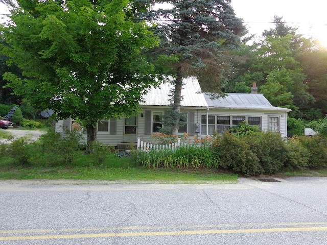 59 Main St, Shapleigh, ME 04076 - view of front facade featuring a chimney
