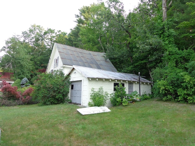 59 Main St, Shapleigh, ME 04076 - view of home's exterior with a yard, an outbuilding, and a metal roof