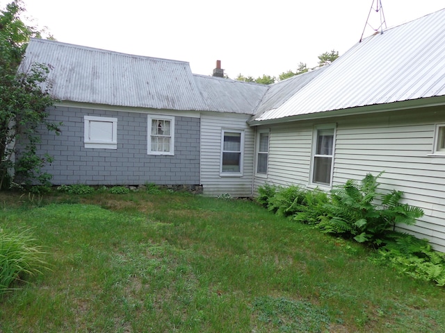59 Main St, Shapleigh, ME 04076 - back of property featuring a metal roof, a chimney, and a lawn