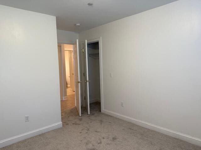 345 Saco St Unit 40, Westbrook, ME 04092 - unfurnished bedroom featuring light colored carpet and a closet