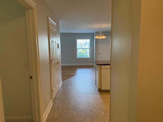 345 Saco St Unit 40, Westbrook, ME 04092 - hall with a chandelier and baseboards