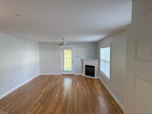 345 Saco St Unit 40, Westbrook, ME 04092 - unfurnished living room with wood finished floors, a fireplace, and ceiling fan
