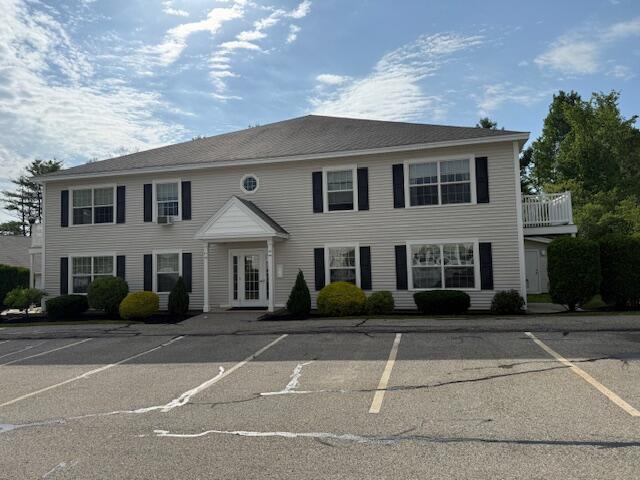 345 Saco St Unit 40, Westbrook, ME 04092 - view of front of house with uncovered parking and french doors