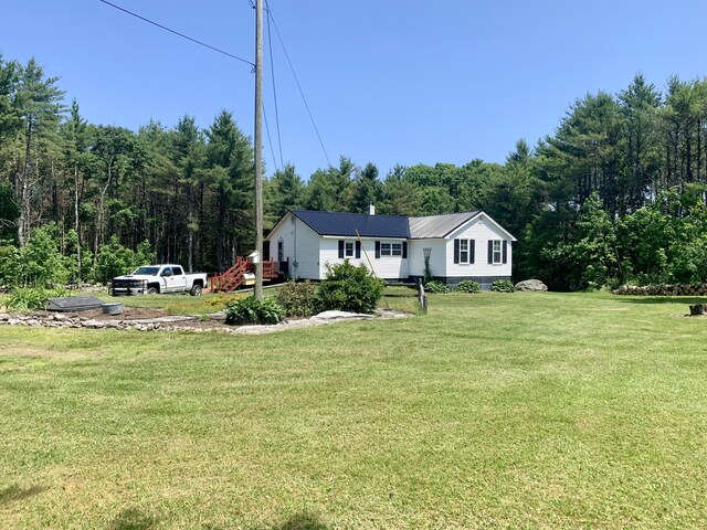 2857 Ohio St, Glenburn, ME 04401 - view of front facade with a front lawn and a view of trees