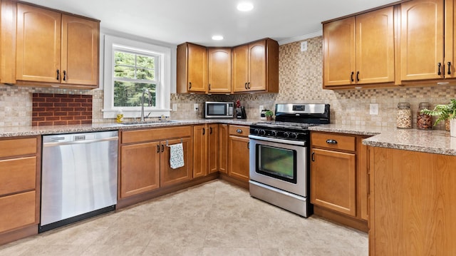 2857 Ohio St, Glenburn, ME 04401 - kitchen featuring stainless steel appliances, decorative backsplash, light stone countertops, crown molding, and recessed lighting