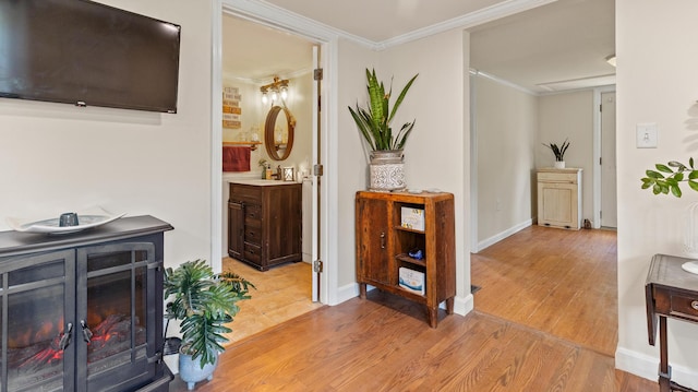 2857 Ohio St, Glenburn, ME 04401 - hall with light wood-style floors and ornamental molding
