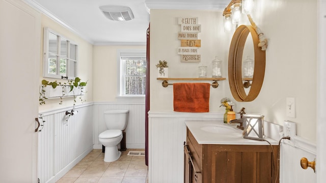 2857 Ohio St, Glenburn, ME 04401 - bathroom with vanity, a wainscoted wall, tile patterned floors, and ornamental molding