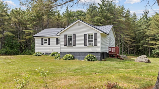 2857 Ohio St, Glenburn, ME 04401 - view of side of home with a yard, a metal roof, and cooling unit
